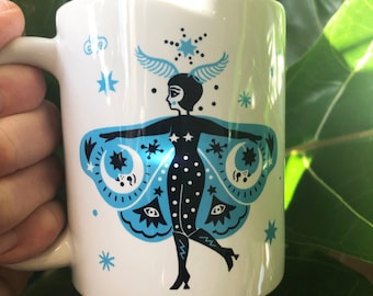 White glossy Celestial Moth Women wrap around mug