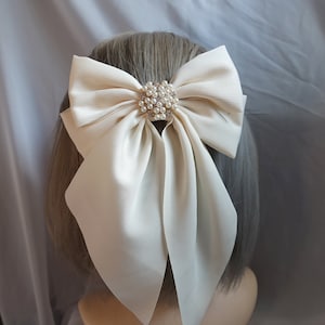 Superbe nœud pour cheveux ivoire orné de strass scintillants - Idéal pour les mariages et les événements spéciaux
