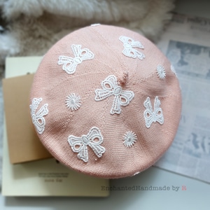 Charming Baby Pink Lightweight Beret with a Chic White Lace Bow on the Back