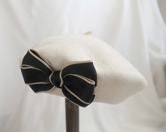 Classic French-Inspired White Beret with Delicate Black Bow Accent