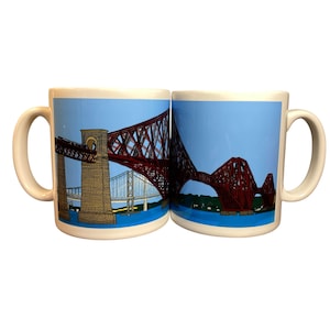 May include: Two white ceramic mugs with a red and white illustration of the Forth Rail Bridge in Scotland. The mugs are facing each other with the bridge spanning across both mugs.