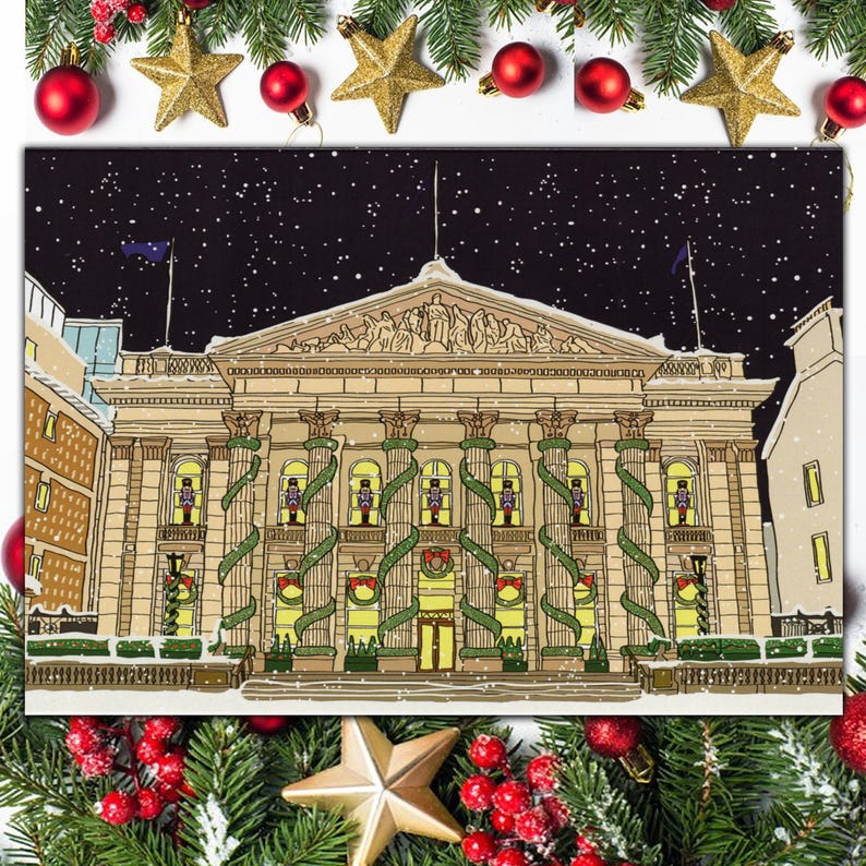 May include: A black and white illustration of a building decorated with Christmas lights and greenery. The building has a large, ornate facade with columns and arches. The illustration is set against a dark blue background with white snowflakes.