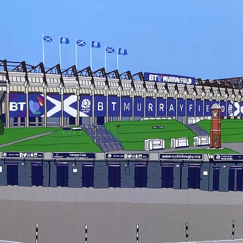 May include: A colorful illustration of a stadium with the text "BT Murrayfield" on the top of the building. The stadium is surrounded by a green lawn and a clock tower. There are several blue and white flags with the Scottish Rugby logo on them.
