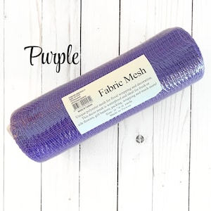 May include: A roll of purple fabric mesh for floral wrapping and decoration. The label reads "Fabric Mesh" and mentions it is waterproof and ideal for fresh or silk flowers, gift baskets, packing, and wrapping. The size is 10 x 10 yards.