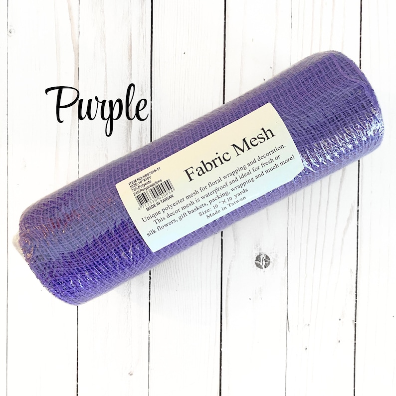 May include: A roll of purple fabric mesh for floral wrapping and decoration. The label reads "Fabric Mesh" and mentions it is waterproof and ideal for fresh or silk flowers, gift baskets, packing, and wrapping. The size is 10 x 10 yards.
