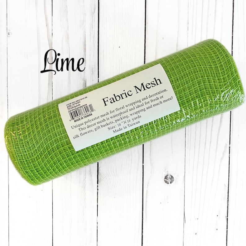 May include: A roll of lime green fabric mesh for floral wrapping and decoration. The label reads "Fabric Mesh" and mentions it is waterproof. The roll is 10" x 10 yards. The word "Lime" is written in cursive in the upper left corner.