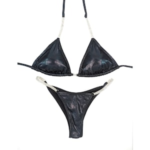 May include: Black bikini with a sparkly finish and crystal embellishments on the straps.