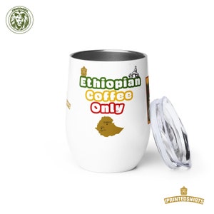 May include: White stainless steel travel mug with a lid. The mug has a green, yellow, and red design with the text "Ethiopian Coffee Only" and an outline of Ethiopia.