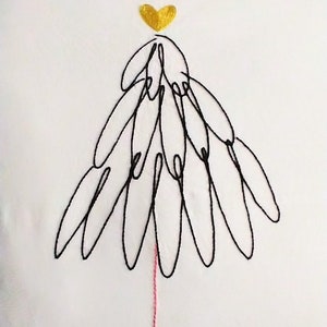 May include: White pillow with a black embroidered Christmas tree design and a gold heart at the top. The tree has a pink thread for the trunk and white pom-poms around the bottom edge.