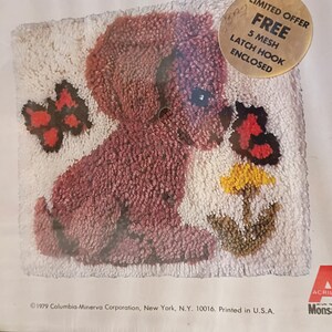 May include: A vintage latch hook rug kit featuring a burgundy puppy, butterflies, and a flower in a pot. The design is on a white background. The kit includes a free 5 mesh latch hook. The text "LIMITED OFFER" is visible.