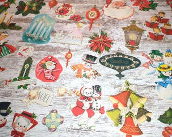 May include: Assortment of vintage Christmas paper cutouts featuring a variety of holiday themes, including Santa Claus, snowmen, angels, bells, candles, and ornaments. The cutouts are printed on white paper with colorful details and are perfect for crafting or decorating.