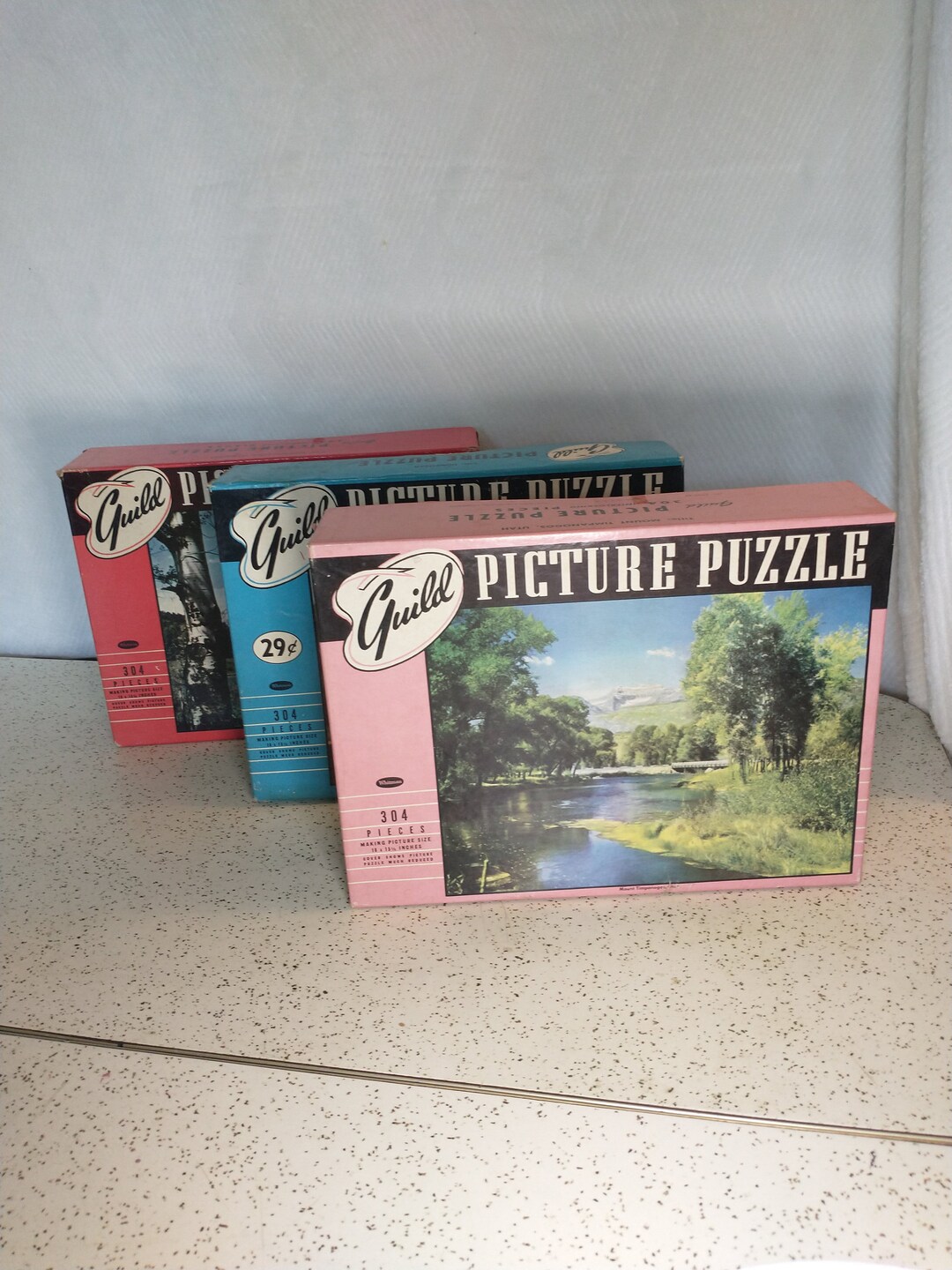 Guild Picture Puzzles Set of Three in Aqua, Pink, and Red 1950s