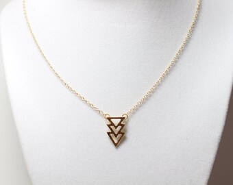 Cute and dainty gold plated triangles necklace.