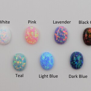 May include: Oval-shaped opal cabochons in various colors, including white, pink, lavender, black cherry, teal, light blue, and dark blue.