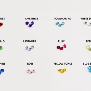 May include: A selection of gemstone beads in various colors, including garnet, amethyst, aquamarine, white, emerald, lavender, ruby, peridot, sapphire, rose, yellow topaz, and blue zircon.