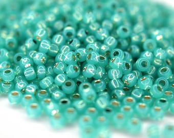 380 EUR/kg || 10g Toho Seed Beads 11/0 Silver-Lined Milky Dark Peridot