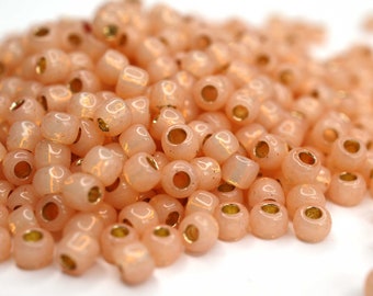 450 EUR/kg || Toho Seed Beads 6/0 Permanent Finish Silver-Lined Milky Peach