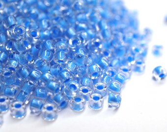 410 EUR/kg || 10g Crystal - Blue Neon-Lined Czech Seed Beads Matubo, 8/0 oder 6/0, Rocailles Schmuck DIY, Mini-Perlen