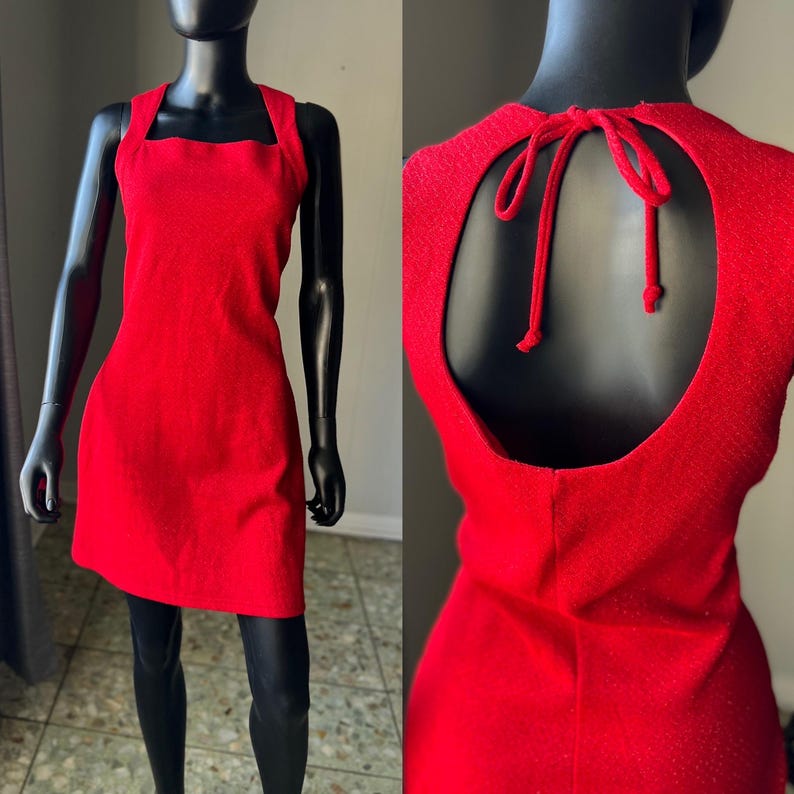 May include: A red sleeveless dress with a square neckline and a keyhole back with a tie closure.