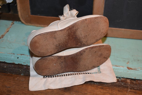 infant white canvas shoes