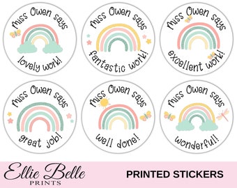 May include: Six round stickers with a rainbow design and the text "Miss Owen says" with different phrases on each sticker. The phrases are "lovely work!" "fantastic work!" "excellent work!" "great job!" "well done!" and "wonderful!"