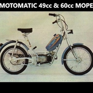May include: A white moped with a blue gas tank and black seat. The moped has a chrome frame and wheels. The moped is a Carabela Motomatic 49cc & 60cc.