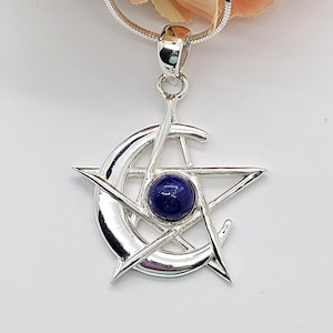 May include: A silver-toned pendant necklace featuring a pentagram design with a crescent moon and a central blue gemstone. The pendant hangs from a delicate silver chain, showcasing a celestial theme.