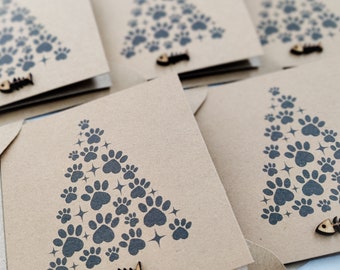 Pack of 5 paw print Christmas cards with wooden fish embellishments