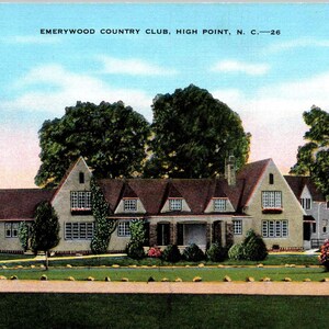 May include: Vintage postcard featuring the Emerywood Country Club in High Point, North Carolina. The image shows a large, light-colored building with a brown roof, surrounded by trees and a well-manicured lawn. The sky is a clear blue.
