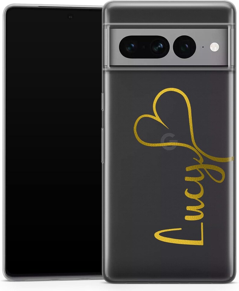 May include: A clear phone case with a black background and a gold heart design. The name "Lucy" is written in gold script below the heart. The phone case is shown with a black smartphone.