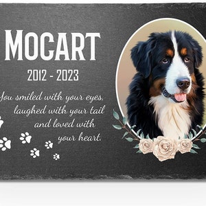 May include: Black and white Bernese Mountain Dog memorial slate with a photo of the dog, the name "MOCART" and the dates "2012 - 2023". The slate also includes the text "You smiled with your eyes, laughed with your tail and loved with your heart."