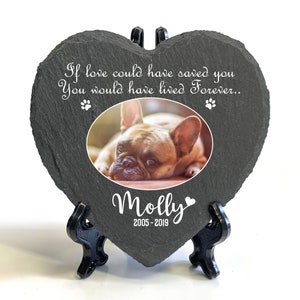 May include: A gray heart-shaped slate memorial with a photo of a French Bulldog, the text "If love could have saved you You would have lived Forever." and the name "Molly" with the dates "2005-2019".