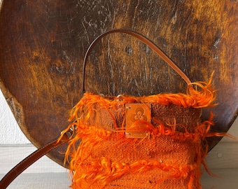Bolso bombonera de kilim TULU con asas de cuero, bolso étnico vintage  asas en  bandolera, bolso  a de lana cerrado en bolsa de tabaco.