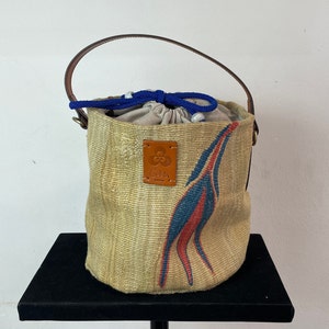 Vintage kilim bag, leather bucket bag with shoulder strap handles. Tobacco bag closure with decorative beads measures 20x21 cm