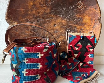 Vintage kilim bag, leather bucket bag with shoulder straps. Tobacco pouch closure with decorative beads. Measures 20x17 cm
