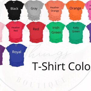 May include: A chart of t-shirt colors with names for each color. The colors include white, black, gray, heather orange, orange, heather heliconia, light pink, heather red, red, irish green, kelly green, heather purple, purple, and royal blue.