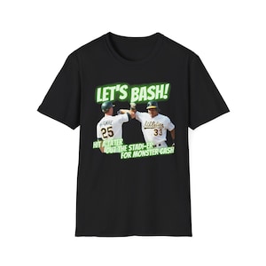 May include: Black t-shirt with a green graphic of two baseball players high-fiving. The text "LET'S BASH!" is above the players. The text "HIT A TATER OUT THE STADI-ER FOR MONSTER CASH" is below the players.