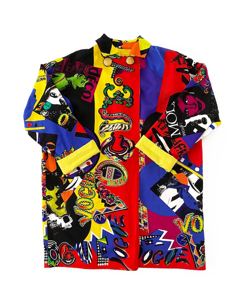 May include: A long-sleeved shirt with a colorful patchwork design featuring various patterns and the word "Vogue" repeated throughout. The shirt is made of a silky fabric and has a button-up front.
