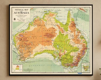 May include: A framed physical map of Australia, featuring a detailed depiction of the continent's topography. The map uses a color-coded system to represent elevation, with shades of green, orange, and brown. The title "Physical Map of Australia" is displayed at the top.