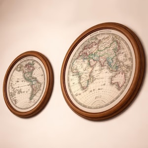 May include: Two oval-shaped framed world maps in a vintage style. The maps feature detailed illustrations of continents and oceans on a light background. The frames are made of dark wood.