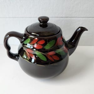 Svart blommig droppfri tekanna, vintage Royal Canadian Art Pottery
