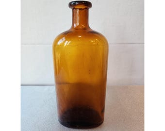 Bottiglia da farmacia vintage in vetro ambrato con tappo in sughero, risalente ai primi del '900.
