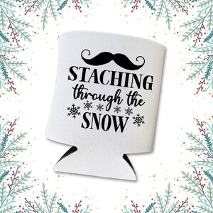 May include: White can cooler with a black mustache and the text "STACHING through the SNOW" with snowflakes.