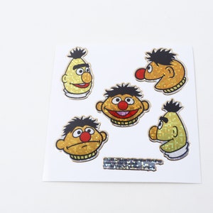 Ulica Sezamkowa Bert i Ernie Jim Henson Muppety Holograficzne Naklejki Kodak Arkusz Postaci z Filmów Animowanych Głowy, Olimpijskie ~ 20-01-18