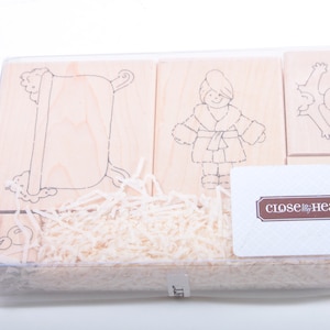 May include: A set of four wooden stamps featuring a bathtub, a person in a robe, a person in a bath, and the text "close to my heart".