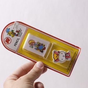 May include: A set of three ceramic mugs with a speckled, matte finish. The mugs are in shades of cream, light gray, and dark gray. Each mug has a simple, minimalist design, perfect for coffee or tea.