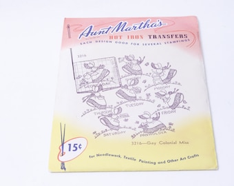 May include: A vintage Aunt Martha's Hot Iron Transfers booklet with a yellow and pink cover. The cover features a design of seven girls in dresses with the days of the week written on their dresses. The booklet is for needlework, textile painting, and other art crafts. The price is 15 pence.