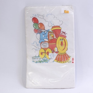May include: A white paper party bag with a colorful illustration of an elephant riding a train with balloons. The train says "Birthday Express" and the back of the train says "Happy Birthday".