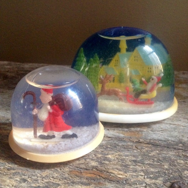 Pair of vintage Christmas Santa themed snow globes