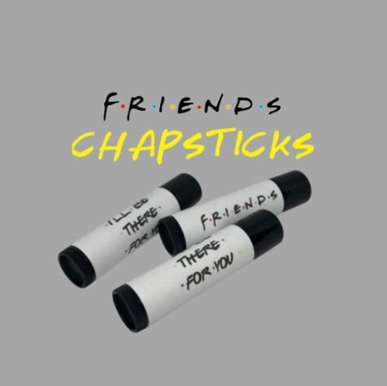May include: Three black and white lip balm tubes with Friends themed labels. The labels read "I'll Be There For You", "Friends", and "There For You".